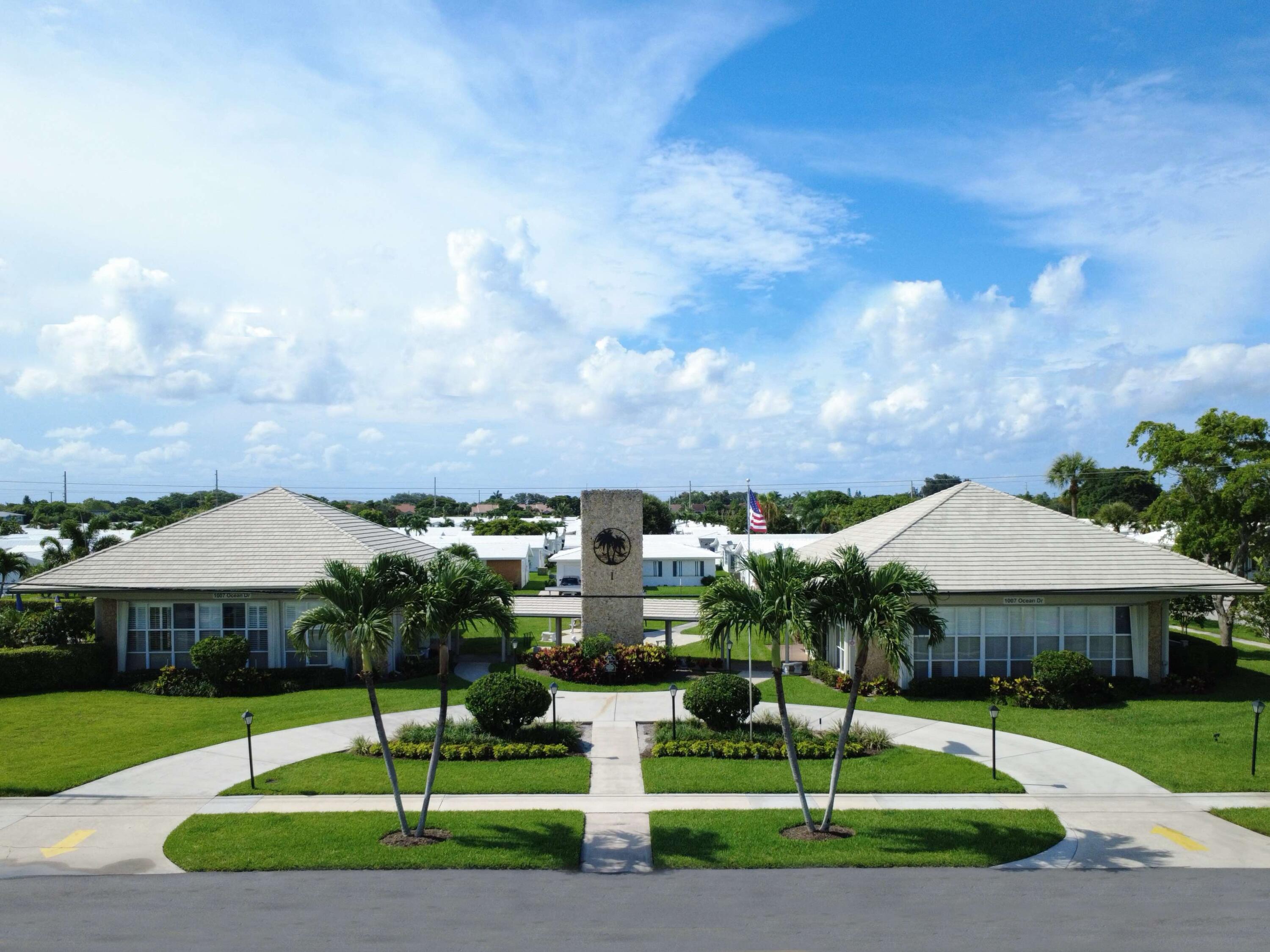 127 Leisureville Boulevard Boynton Beach, FL 33426 - Photo 19 of 23 a front view of a house with garden