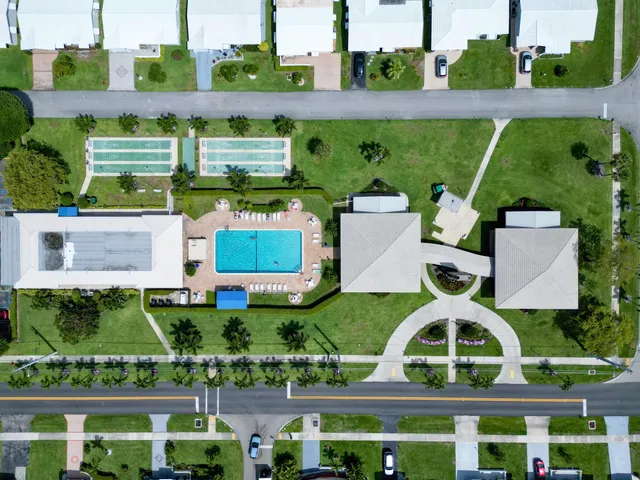 a view of a swimming pool with sitting area