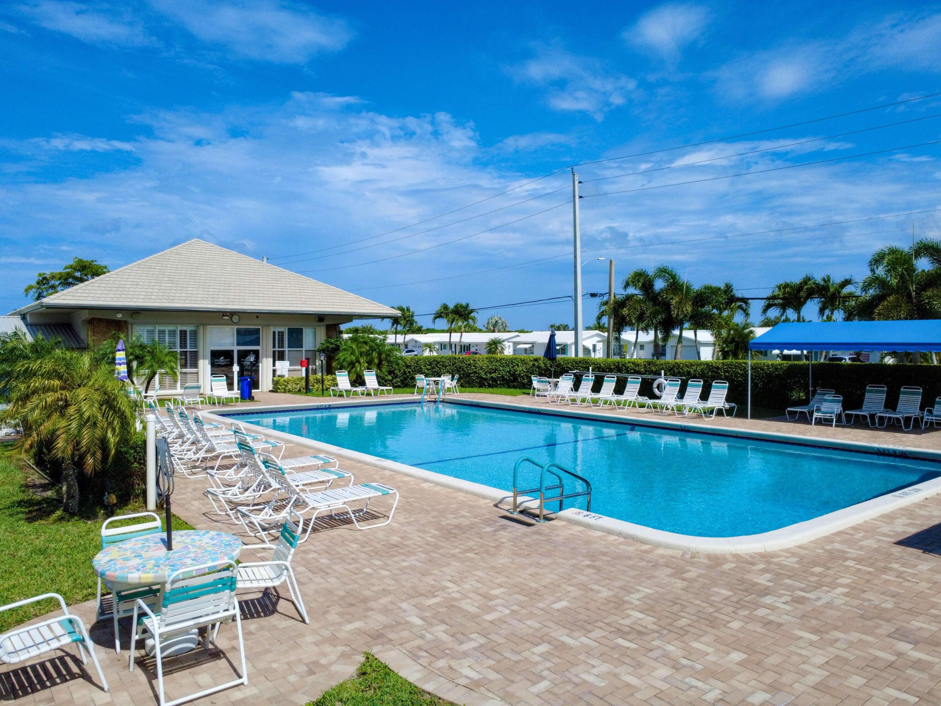 127 Leisureville Boulevard Boynton Beach, FL 33426 - Photo 21 of 23 a view of a swimming pool with sitting area