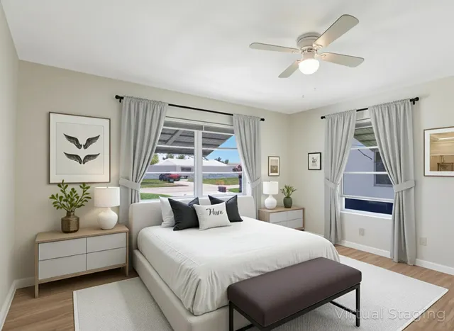 a bedroom with a large bed and a window