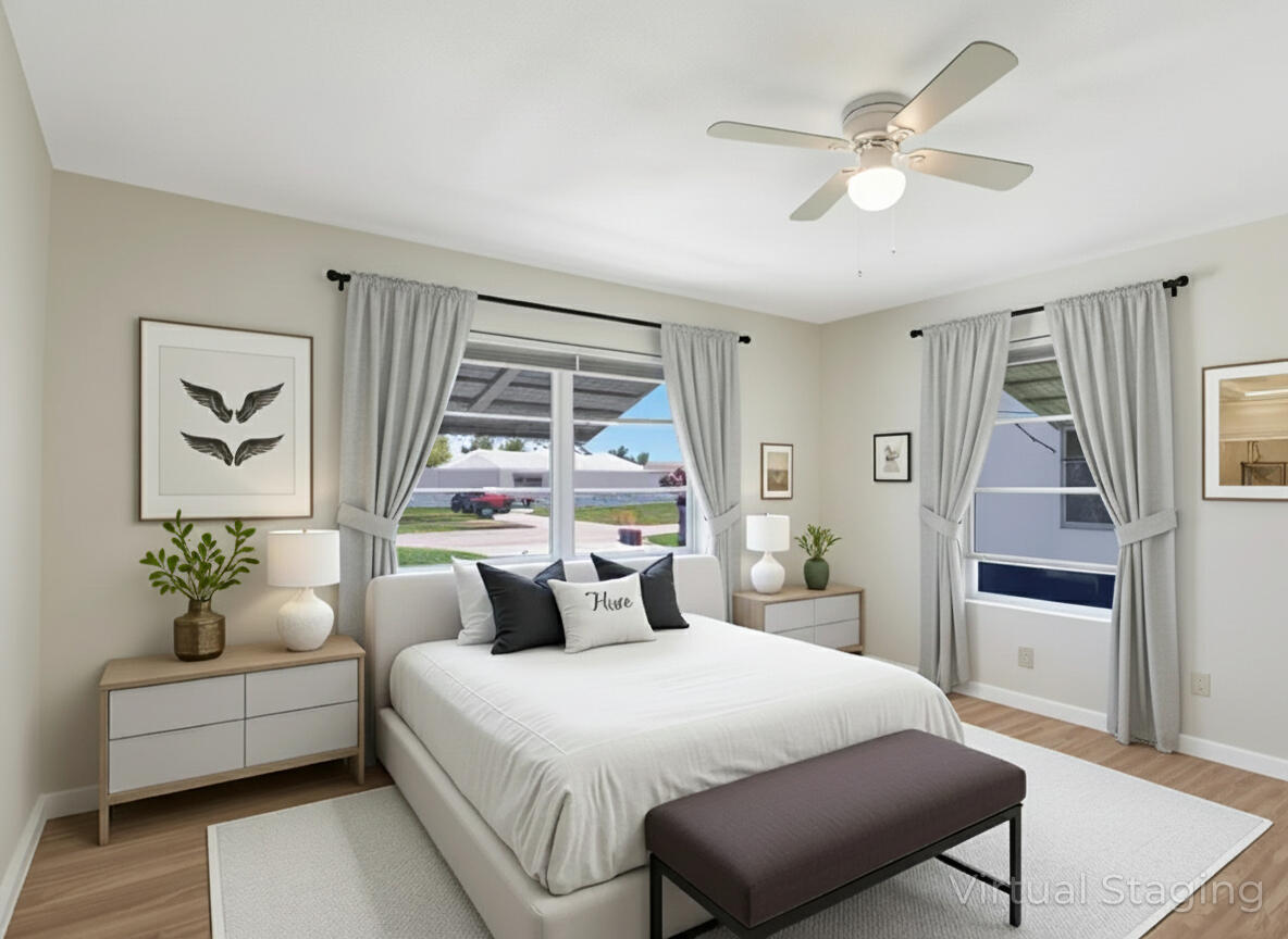 127 Leisureville Boulevard Boynton Beach, FL 33426 - Photo 9 of 23 a bedroom with a large bed and a window