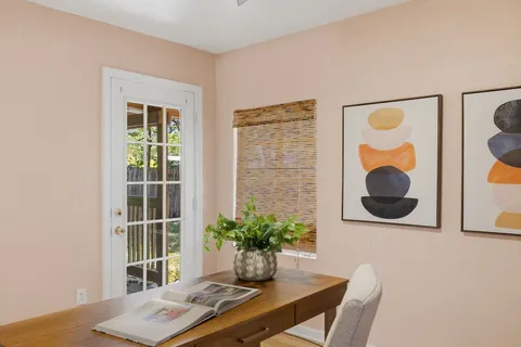 a workspace with furniture and window