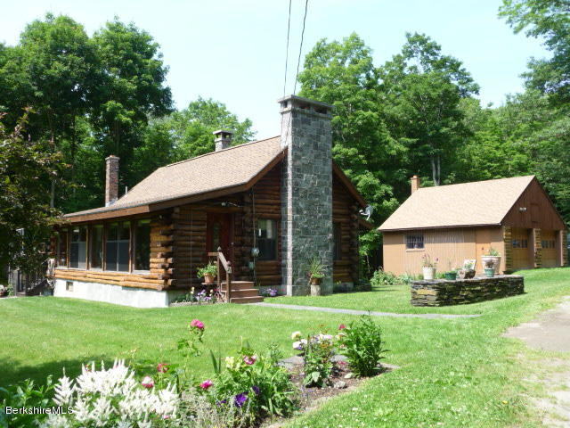 51 Madden Road Hancock, MA 01237 - Photo 1 of 19 a front view of a house with garden