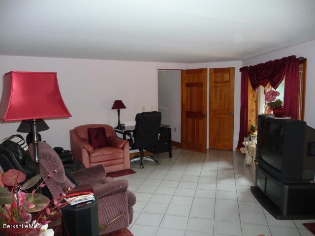 51 Madden Road Hancock, MA 01237 - Photo 14 of 19 a living room with furniture and a lamp