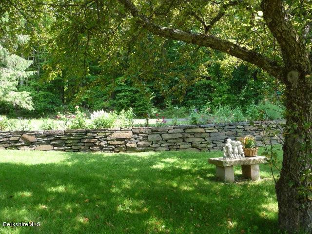 51 Madden Road Hancock, MA 01237 - Photo 3 of 19 a backyard of a house with table and chairs