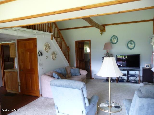51 Madden Road Hancock, MA 01237 - Photo 10 of 19 a living room with furniture and a lamp