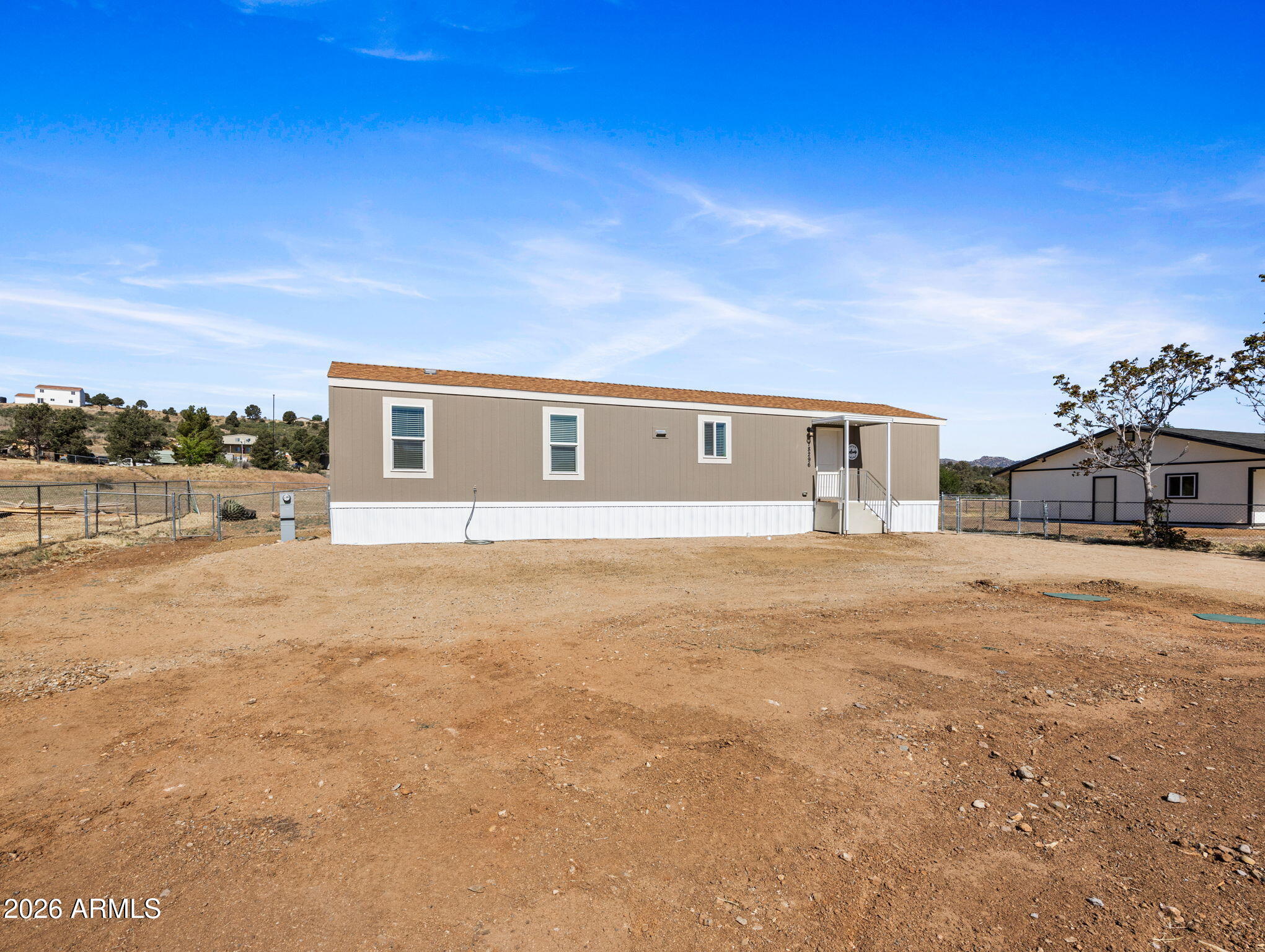 18296 Frontier Road Peeples Valley, AZ 86332 - Photo 42 of 44 a house view with a outdoor space