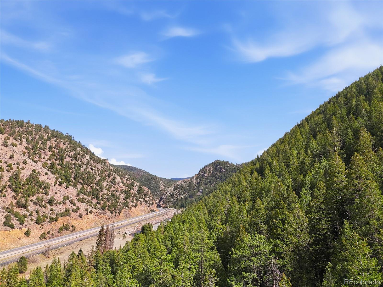 2238 Stanley Road Dumont, CO 80436 - Photo 14 of 20 a view of a large building with a mountain in the background