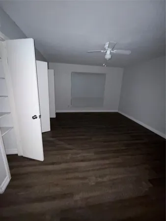 a view of a kitchen with wooden floor and a sink