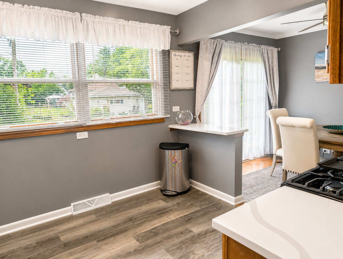 476 Raupp Boulevard Buffalo Grove, IL 60089 - Photo 4 of 20 a room with wooden floor and window