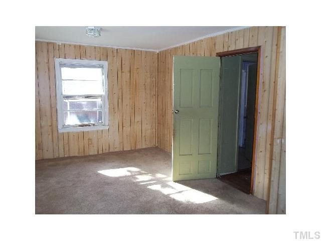 504 Rose Lane Raleigh, NC 27610 - Photo 6 of 7 a view of a room that has a large window in it