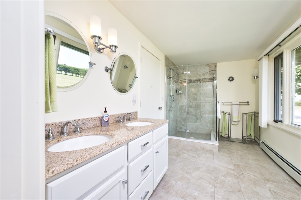 34 North Shore Drive, Unit 3 Dartmouth, MA 02748 - Photo 13 of 34 a spacious bathroom with a granite countertop sink mirror and shower