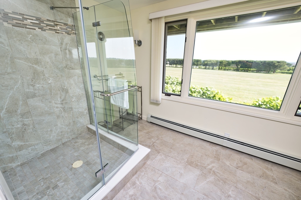 34 North Shore Drive, Unit 3 Dartmouth, MA 02748 - Photo 14 of 34 a bathroom with a bathtub and shower