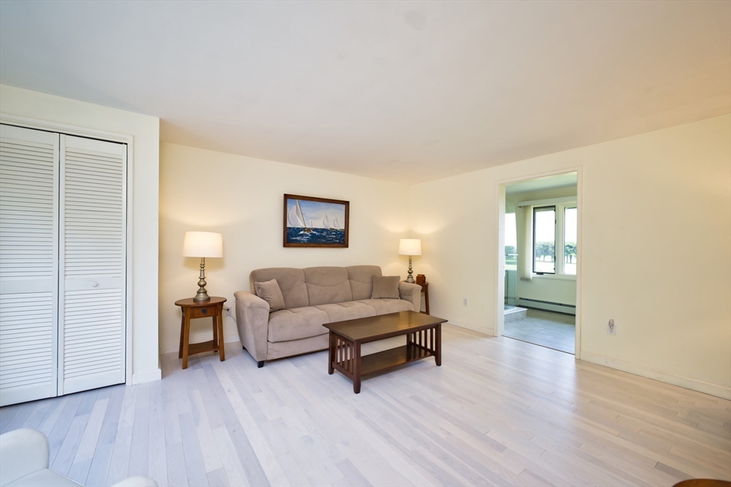 34 North Shore Drive, Unit 3 Dartmouth, MA 02748 - Photo 17 of 34 a living room with furniture and a wooden floor