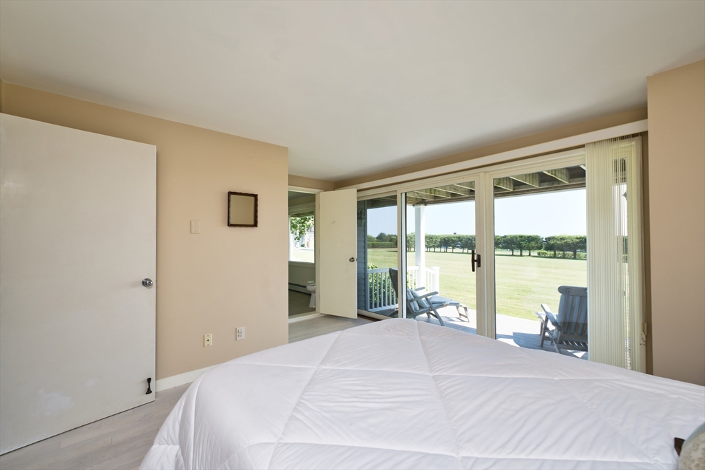 34 North Shore Drive, Unit 3 Dartmouth, MA 02748 - Photo 20 of 34 a bedroom with a large bed and a large window