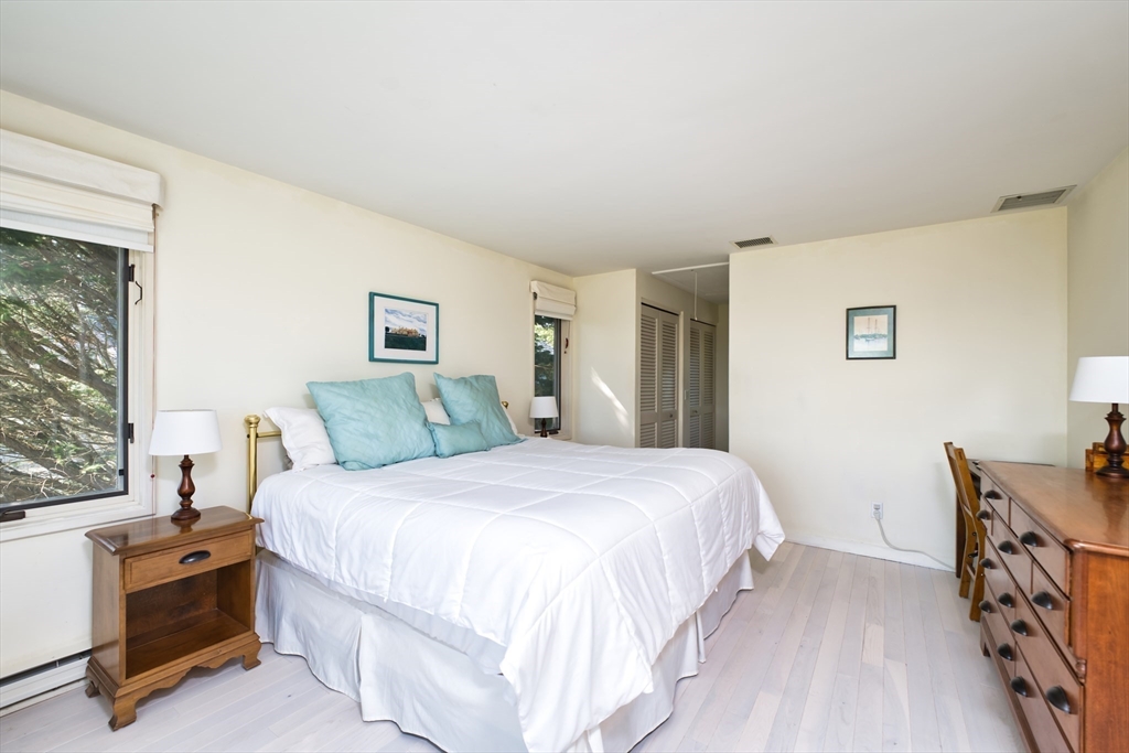 34 North Shore Drive, Unit 3 Dartmouth, MA 02748 - Photo 21 of 34 a bedroom with a bed and a dresser