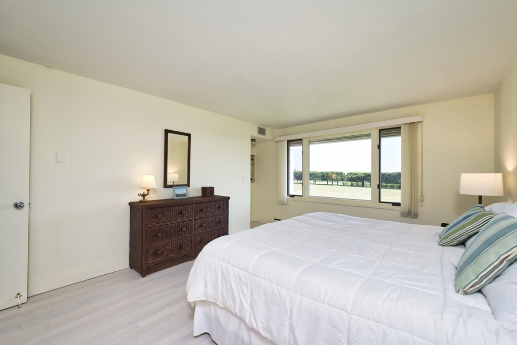 34 North Shore Drive, Unit 3 Dartmouth, MA 02748 - Photo 23 of 34 a bedroom with a bed and a dresser