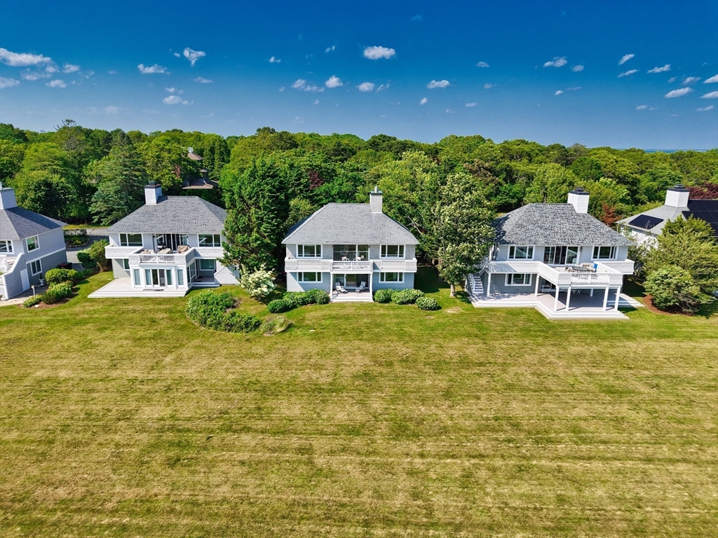 34 North Shore Drive, Unit 3 Dartmouth, MA 02748 - Photo 25 of 34 a front view of a house with yard and green space