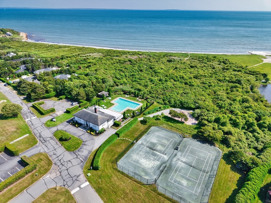 34 North Shore Drive, Unit 3 Dartmouth, MA 02748 - Photo 27 of 34 a view of a swimming pool with lawn chairs