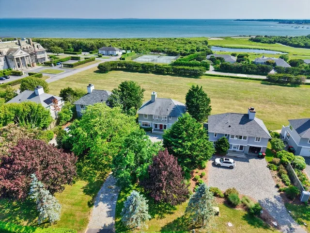 an aerial view of a house with a lake view