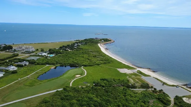 an aerial view of a golf course with parking space
