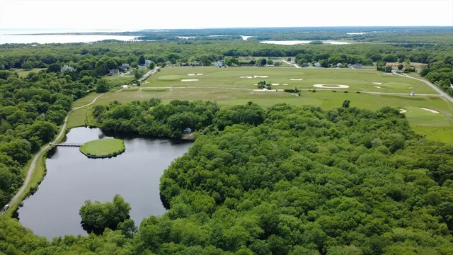 an aerial view of a houses with outdoor space and street view