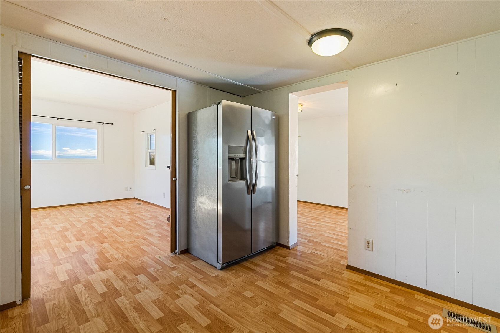 8080 Harborview Road, Unit 167 Blaine, WA 98230 - Photo 15 of 27 a view of empty room with wooden floor