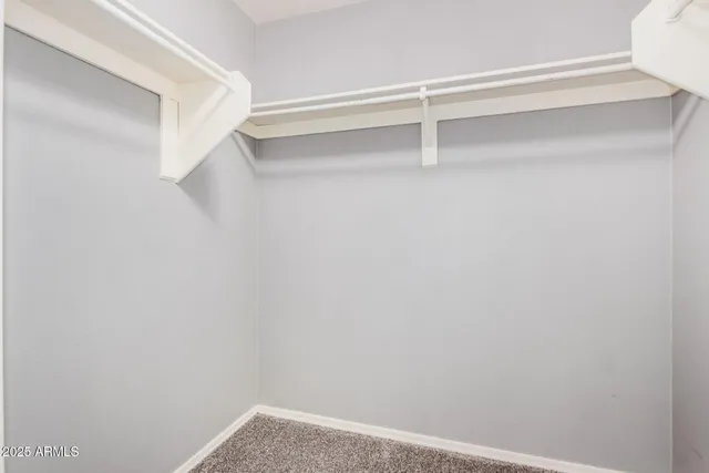 a view of an empty walk in closet