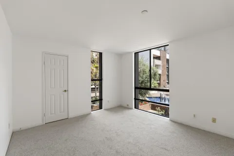 an empty room with windows