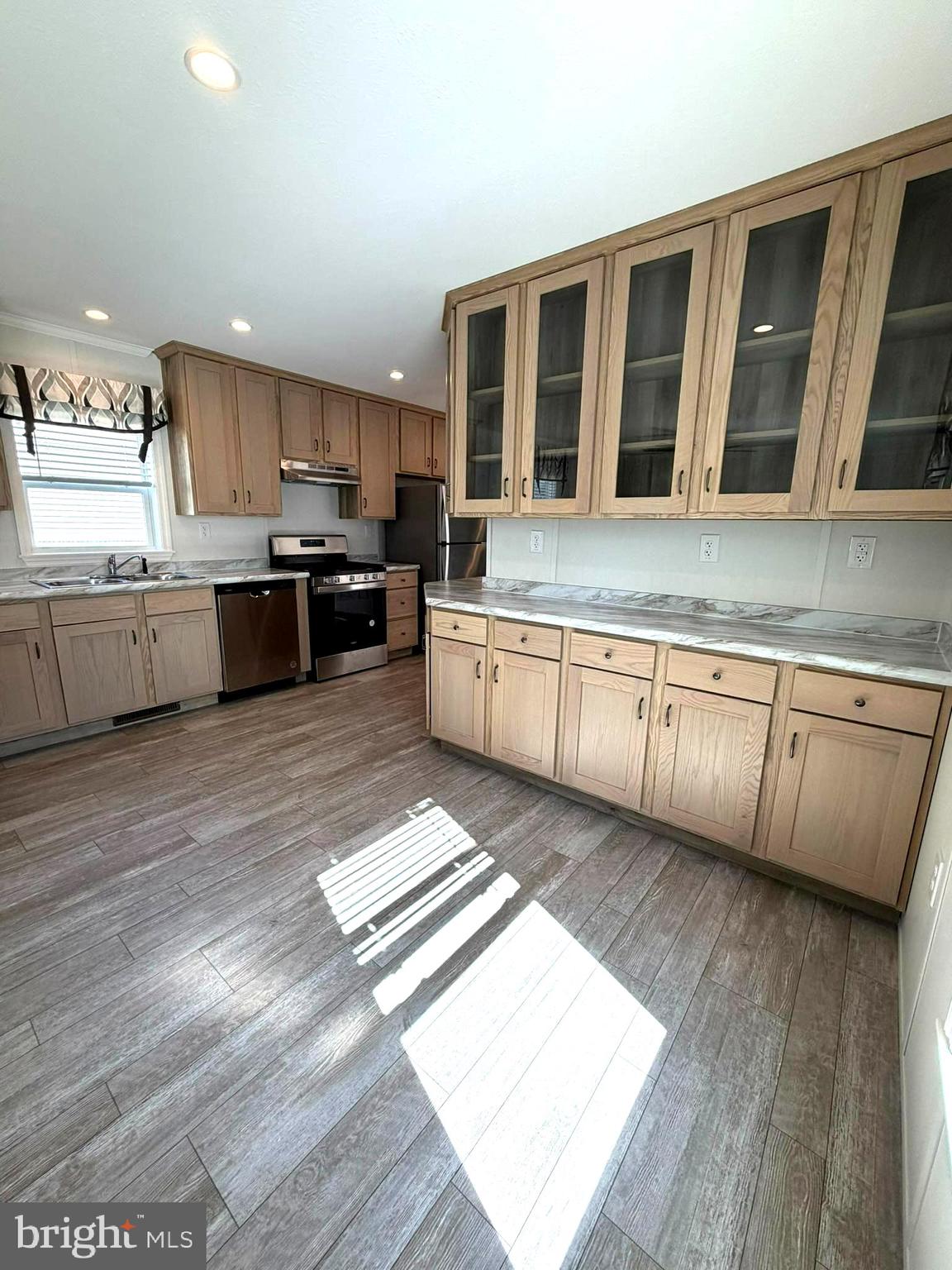 365 East Cherry Road Quakertown, PA 18951 - Photo 11 of 51 a large kitchen with stainless steel appliances kitchen island granite countertop a large counter top space a sink and cabinets