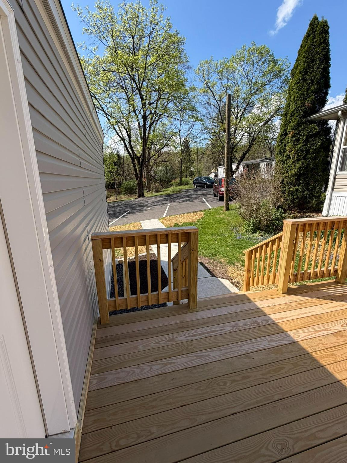 365 East Cherry Road Quakertown, PA 18951 - Photo 45 of 51 a view of a deck with wooden floor and fence next to a yard