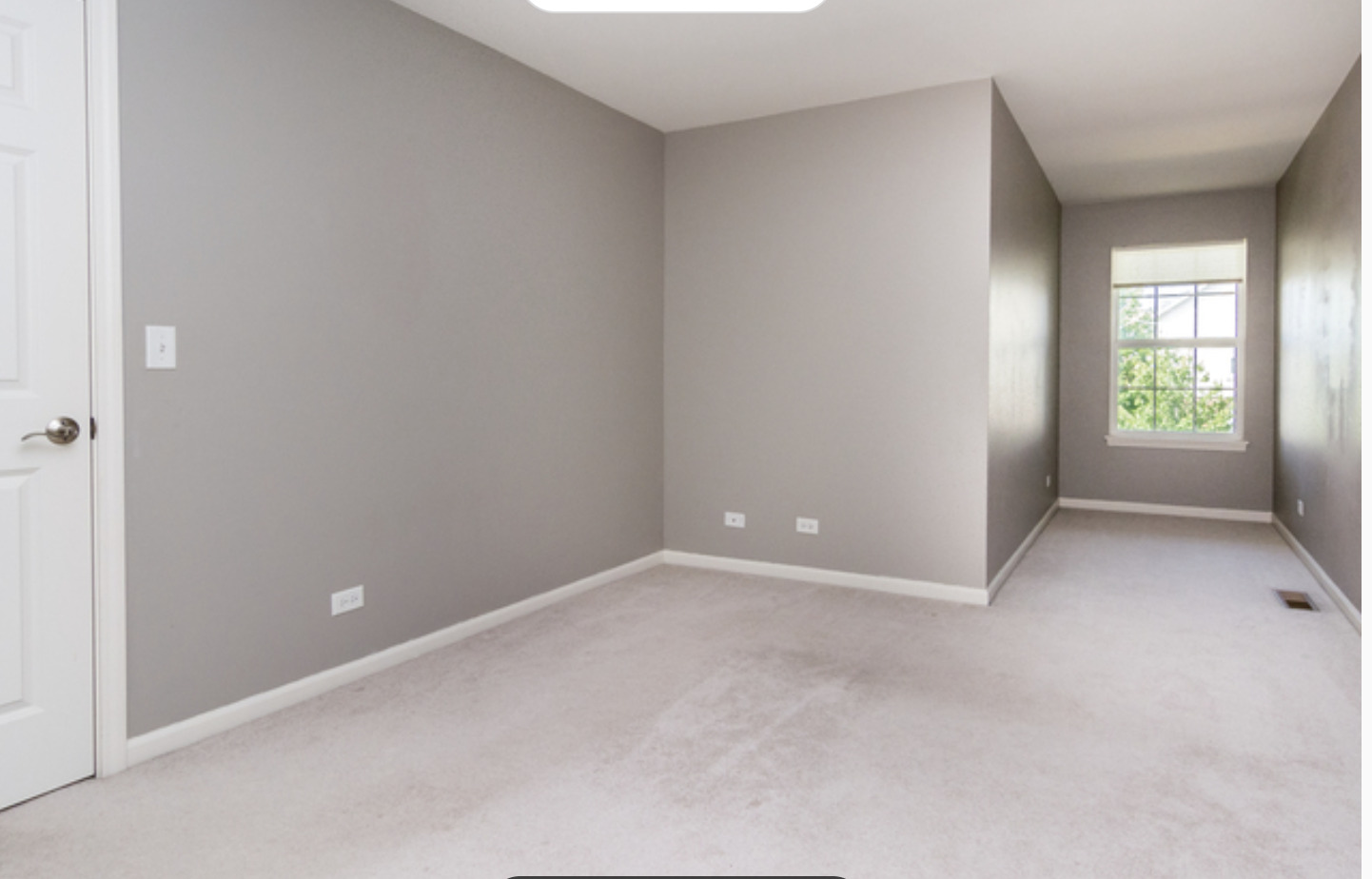 10-s449 Carrington Circle Burr Ridge, IL 60527 - Photo 12 of 21 an empty room with windows