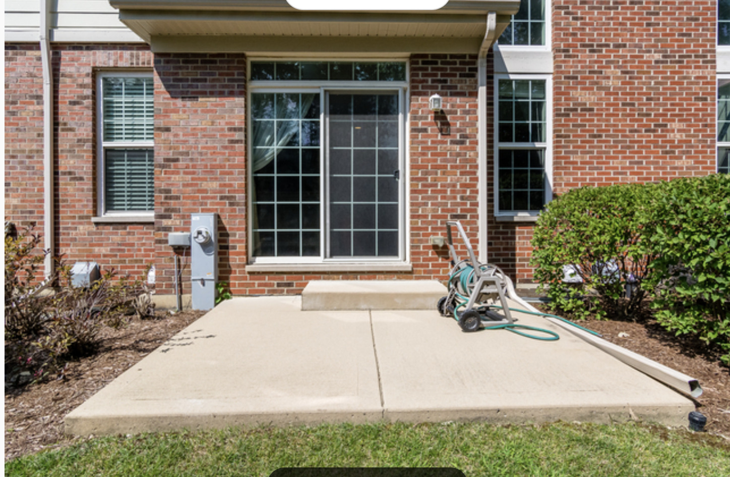 10-s449 Carrington Circle Burr Ridge, IL 60527 - Photo 2 of 21 a front view of a house with a yard