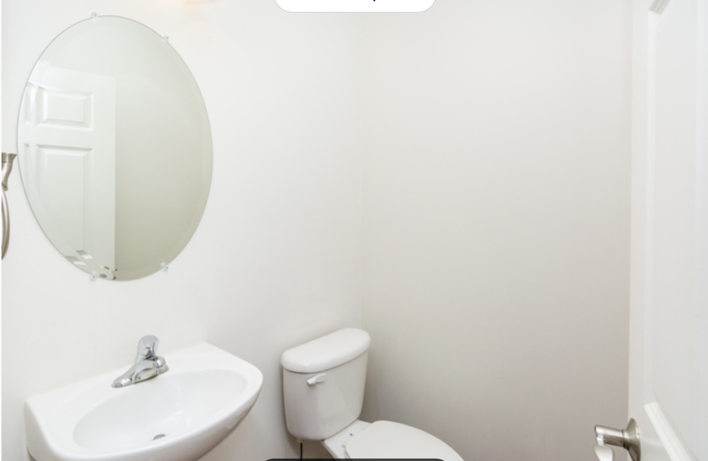 10-s449 Carrington Circle Burr Ridge, IL 60527 - Photo 4 of 21 a bathroom with a toilet a sink and mirror