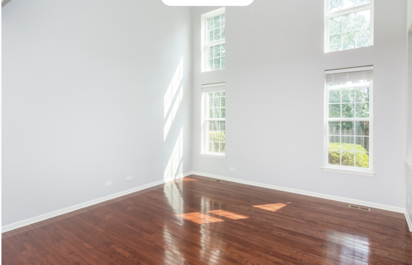 10-s449 Carrington Circle Burr Ridge, IL 60527 - Photo 5 of 21 an empty room with wooden floor and windows
