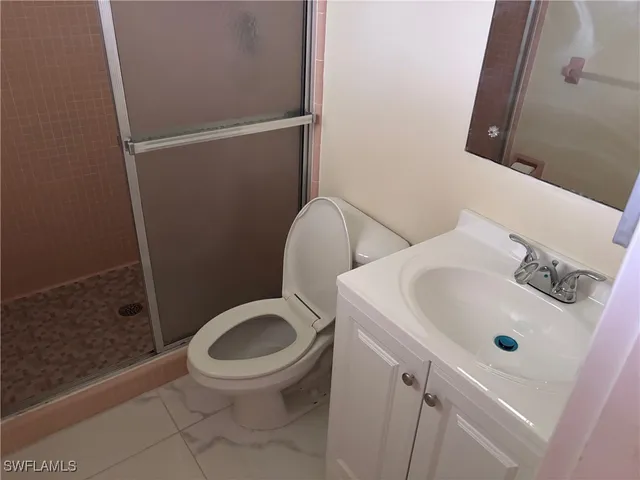 a room with water heater and storage racks