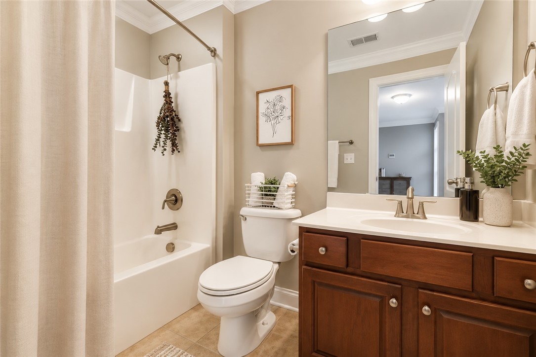 15 Fawn Hill Drive Anderson, SC 29621 - Photo 28 of 38 This bathroom features a single vanity, crown molding, and tiled flooring.
