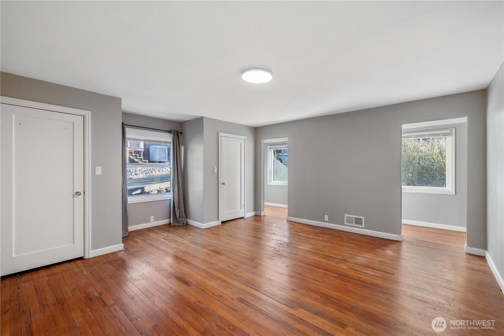 2 Country Club Drive Longview, WA 98632 - Photo 12 of 40 a view of an empty room with window and wooden floor