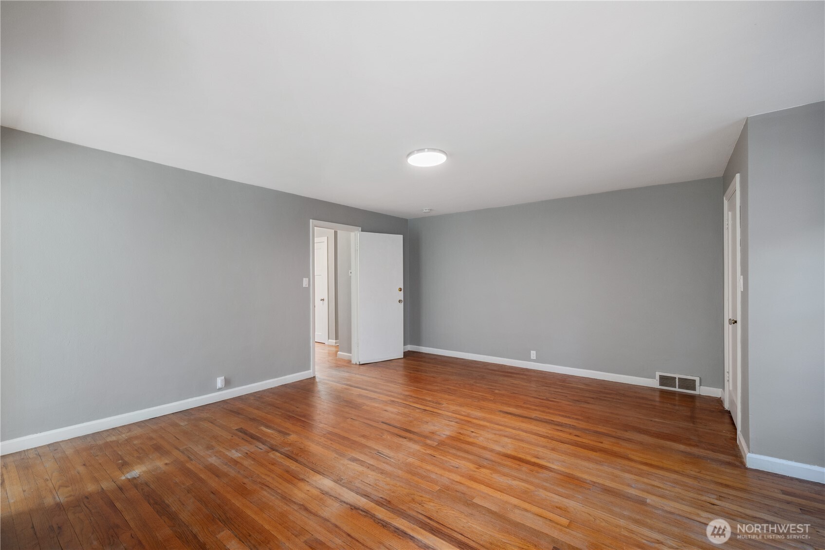 2 Country Club Drive Longview, WA 98632 - Photo 13 of 40 a view of an empty room with wooden floor