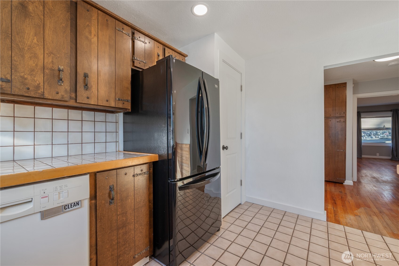 2 Country Club Drive Longview, WA 98632 - Photo 18 of 40 a kitchen with metallic refrigerator freezer and a dishwasher