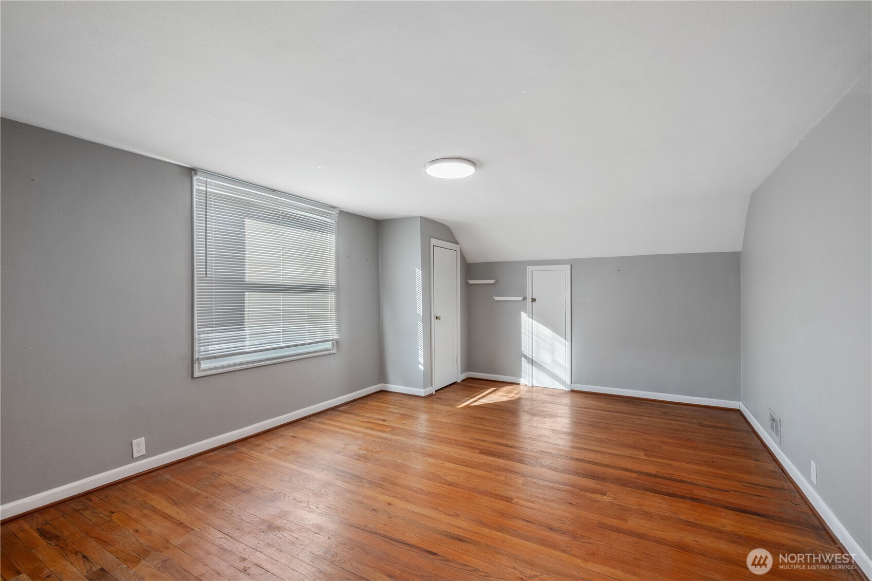 2 Country Club Drive Longview, WA 98632 - Photo 21 of 40 a view of an empty room with wooden floor and a window