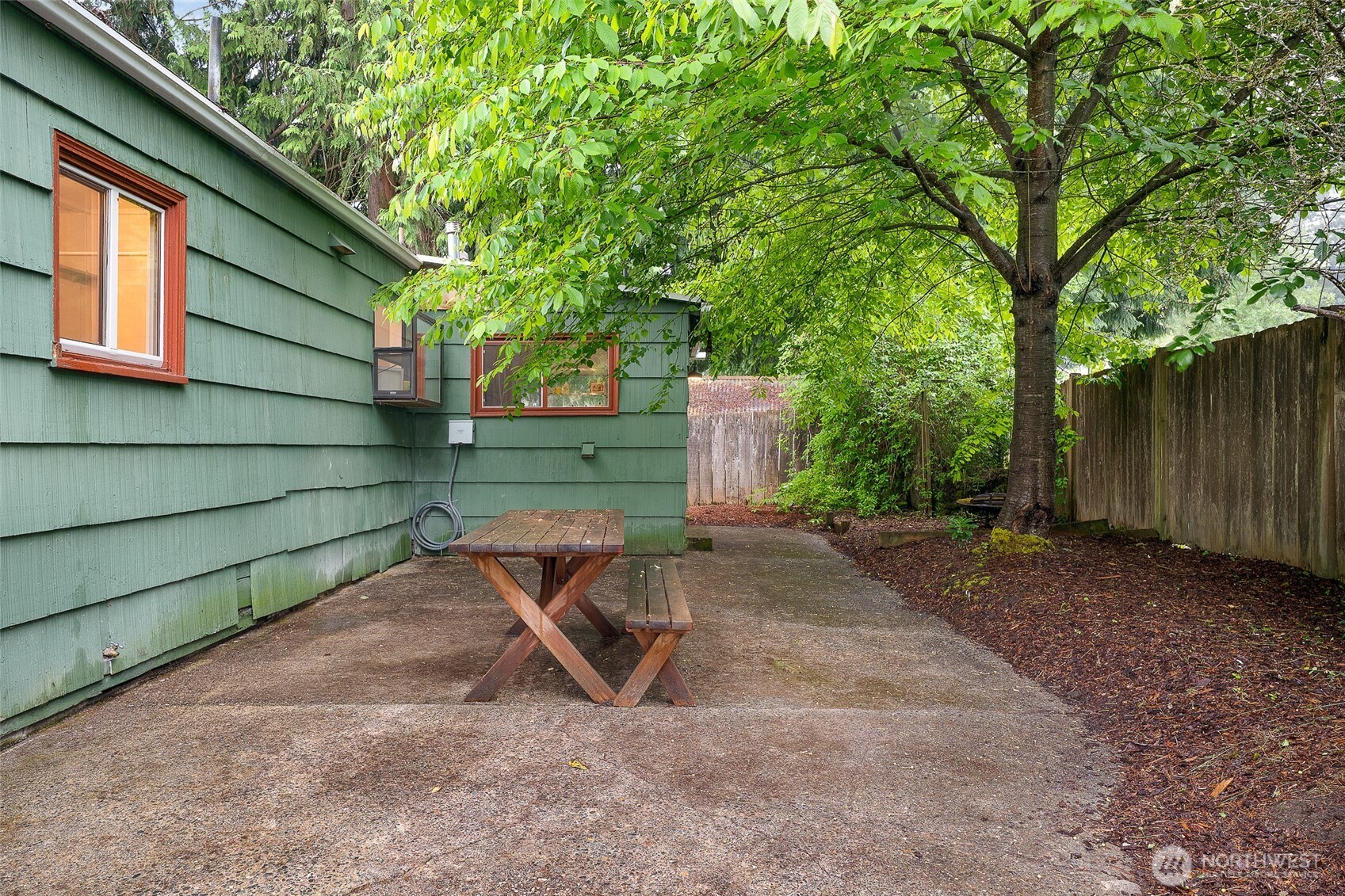 17633 10th Avenue Northeast Shoreline, WA 98155 - Photo 25 of 33 a wooden bench sitting in front of a building