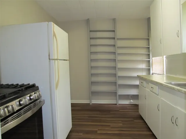 a view of storage and utility room with empty racks
