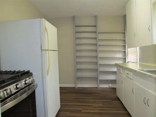 a view of storage and utility room with empty racks