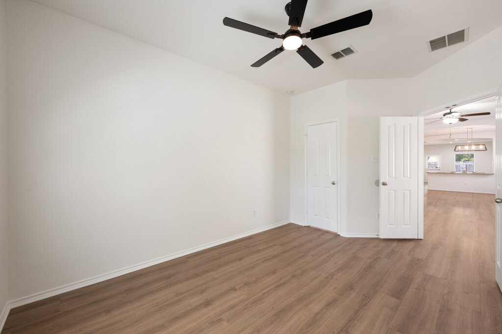 11744 Easy Street Austin, TX 78748 - Photo 5 of 40 Smooth wood floors and crisp white walls define this versatile interior space.