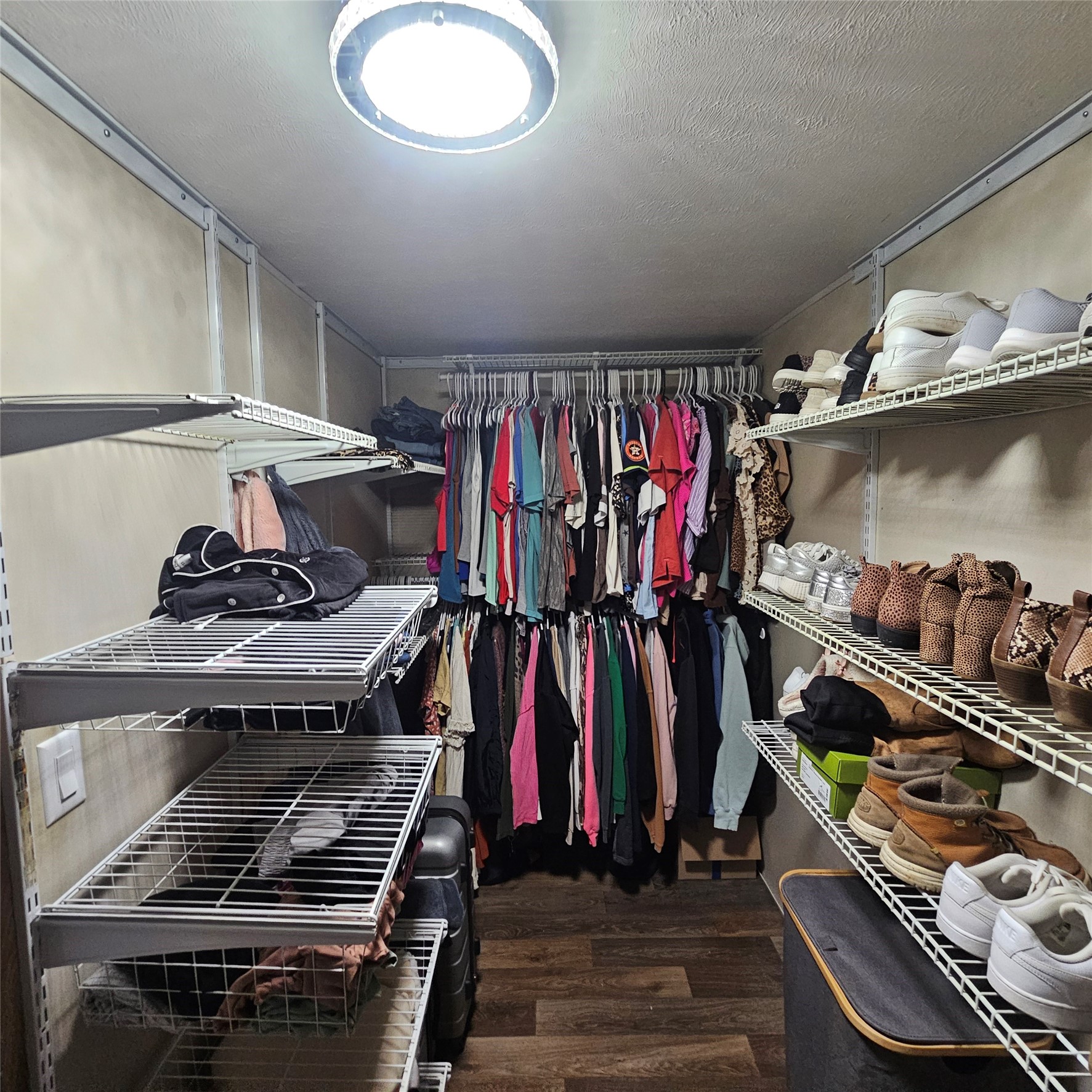 139 Malcom Street Ames, TX 77575 - Photo 11 of 26 a view of a closet with storage