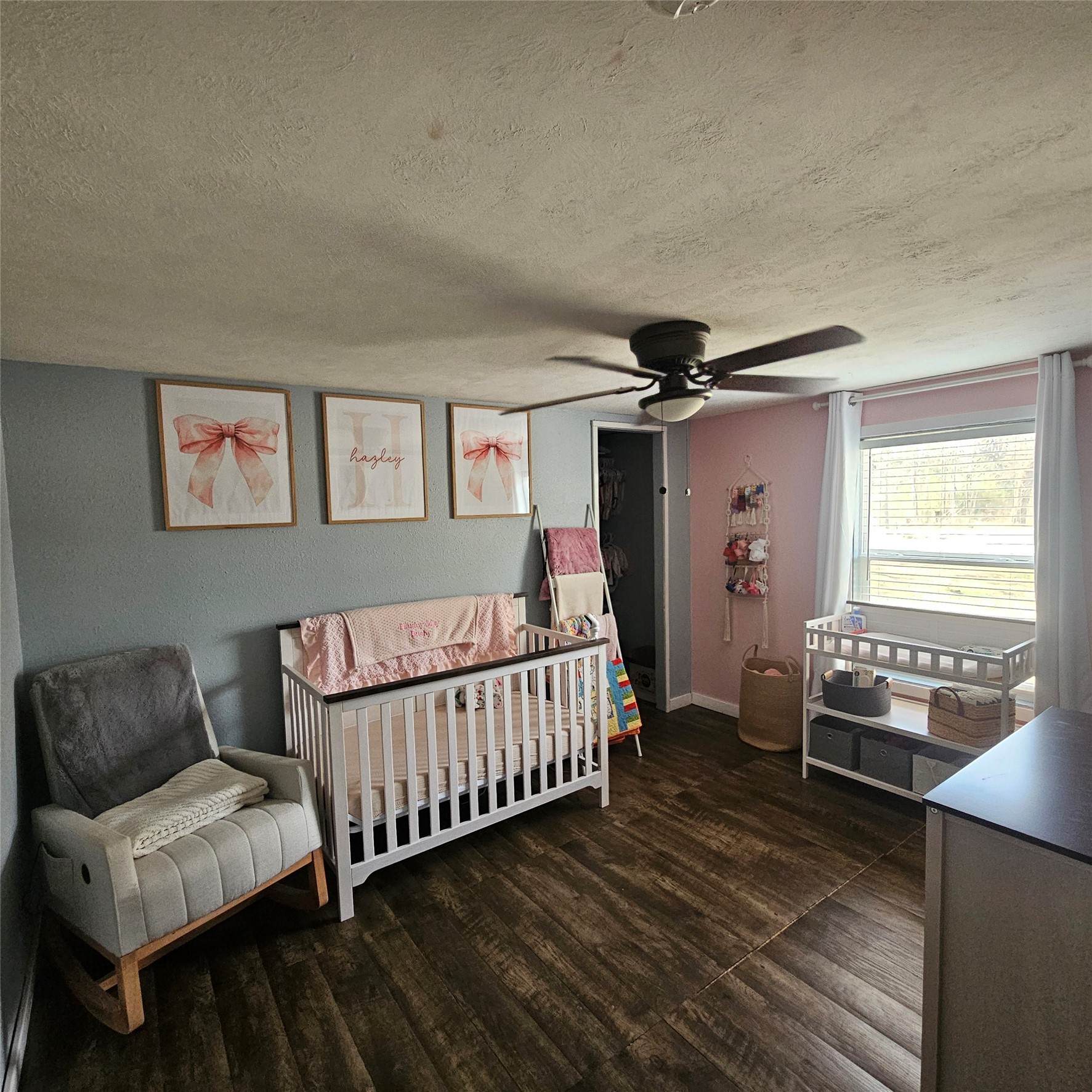 139 Malcom Street Ames, TX 77575 - Photo 15 of 26 a bedroom with furniture and a window