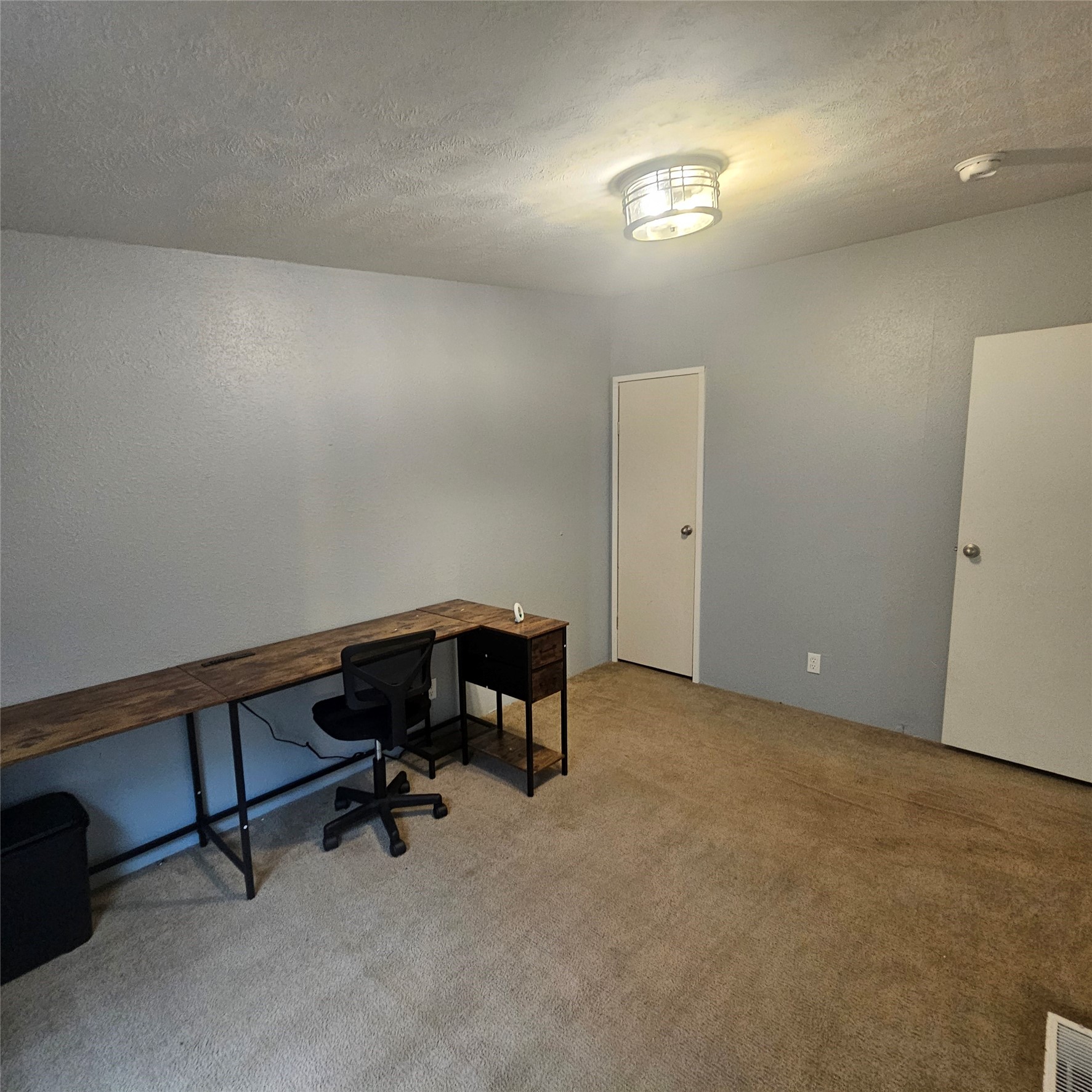139 Malcom Street Ames, TX 77575 - Photo 21 of 26 a view of a workspace