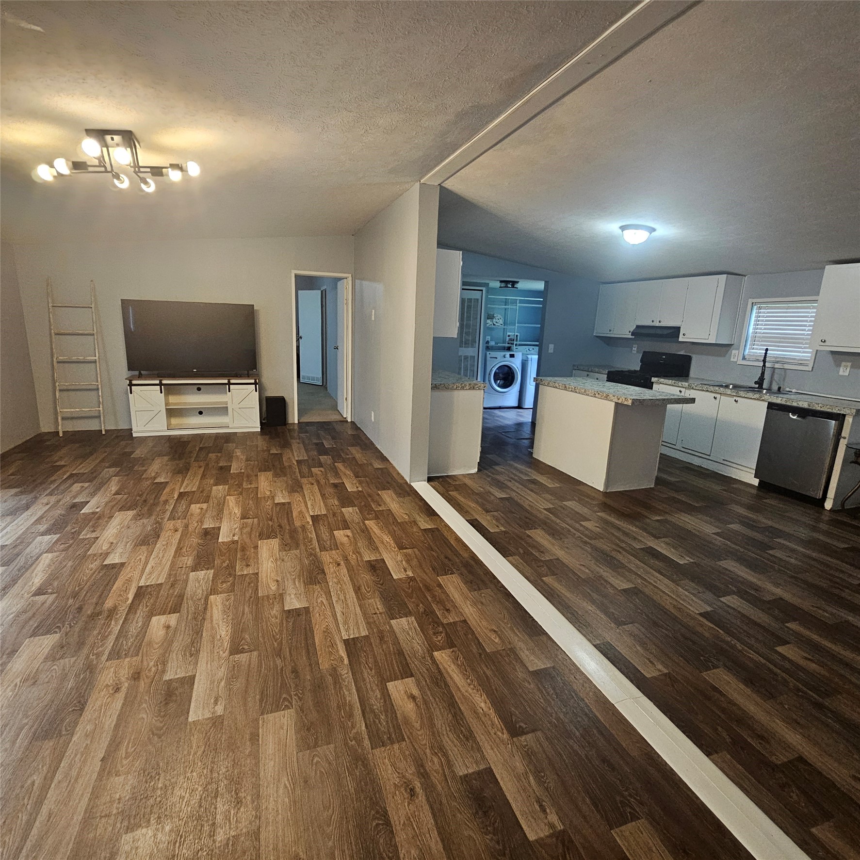 139 Malcom Street Ames, TX 77575 - Photo 23 of 26 a living room with furniture and a flat screen tv
