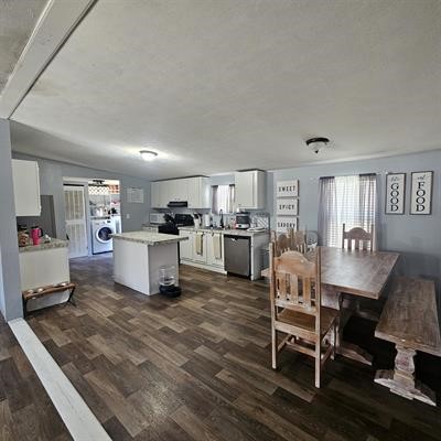 139 Malcom Street Ames, TX 77575 - Photo 3 of 26 a living room with furniture and kitchen view